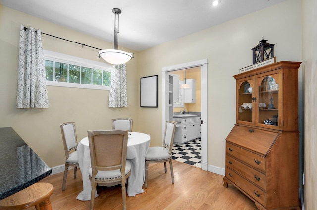 401 E Glendale St, Aurora, MO 65605 - dining area featuring light wood-style flooring and baseboards