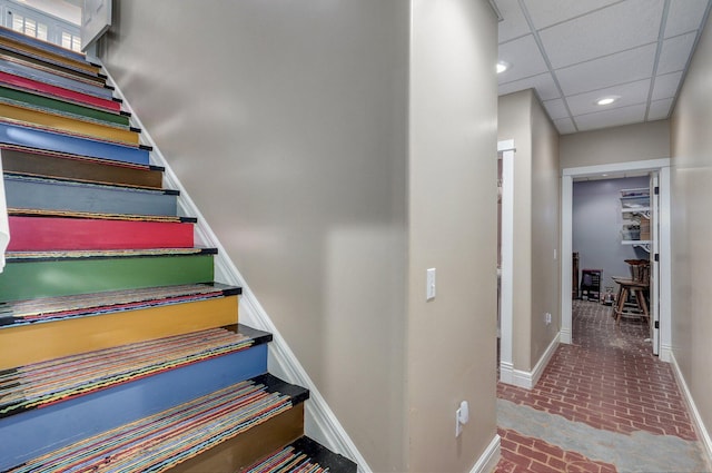 401 E Glendale St, Aurora, MO 65605 - staircase featuring brick flooring, baseboards, and recessed lighting