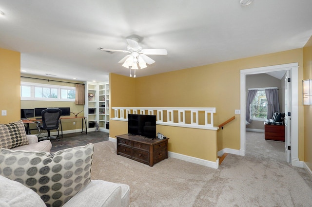 401 E Glendale St, Aurora, MO 65605 - carpeted living area featuring a desk, a ceiling fan, and baseboards
