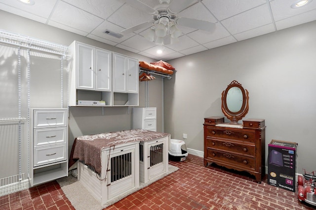 401 E Glendale St, Aurora, MO 65605 - bedroom featuring brick patterned flooring, a drop ceiling, baseboards, and ceiling fan