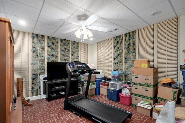 401 E Glendale St, Aurora, MO 65605 - exercise room with ceiling fan, a paneled ceiling, and brick patterned flooring