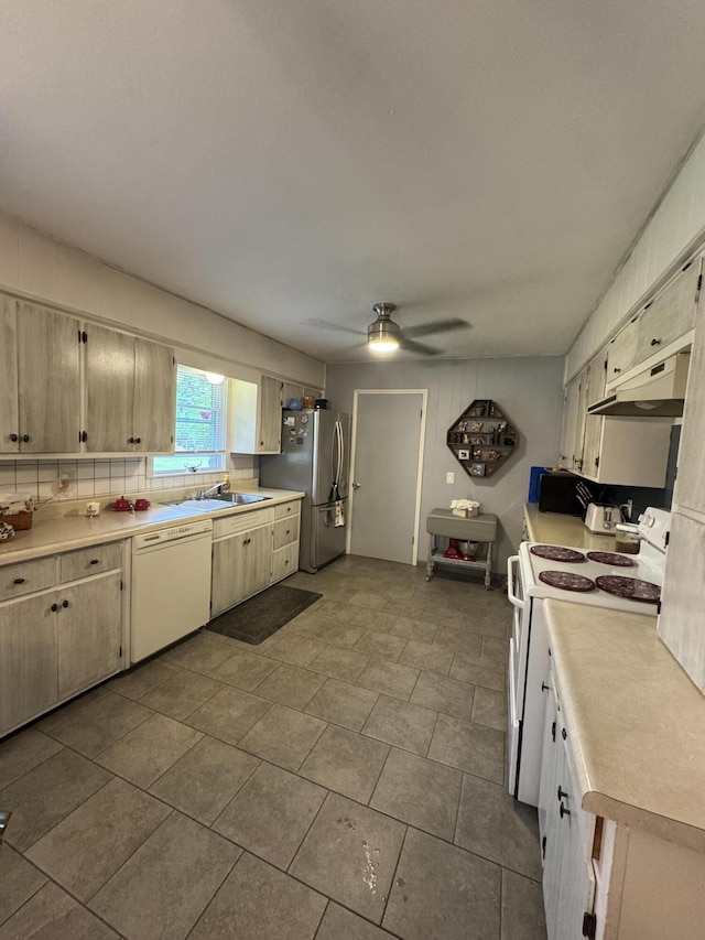 853 Sunset Ave, Marshfield, MO 65706 - kitchen with white appliances, under cabinet range hood, light countertops, a ceiling fan, and a sink