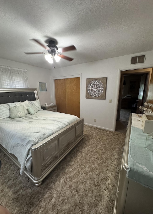 853 Sunset Ave, Marshfield, MO 65706 - carpeted bedroom featuring a textured ceiling, a closet, a ceiling fan, and baseboards