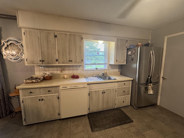 853 Sunset Ave, Marshfield, MO 65706 - kitchen with white dishwasher, a sink, freestanding refrigerator, and light countertops