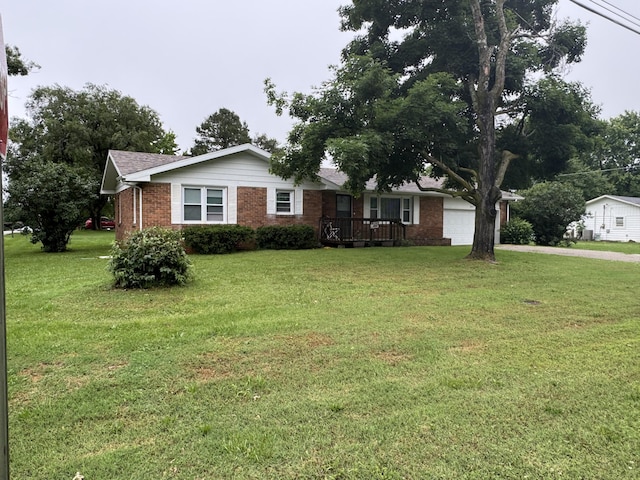 853 Sunset Ave, Marshfield, MO 65706 - single story home with brick siding, an attached garage, a front yard, and driveway