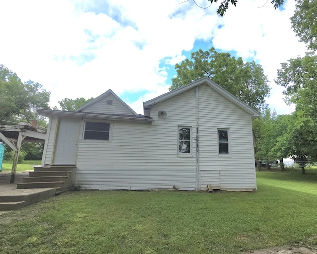 221 Boisseau St, Greenfield, MO 65661 - view of home's exterior featuring entry steps and a lawn
