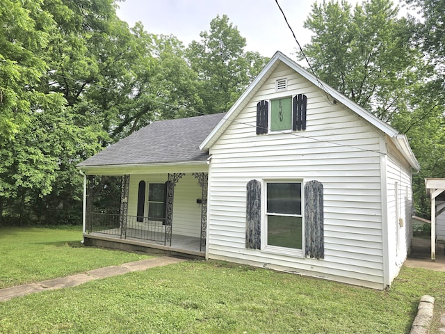 221 Boisseau St, Greenfield, MO 65661 - view of front of house with a porch, a front yard, and roof with shingles