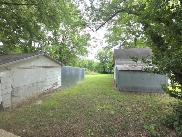 221 Boisseau St, Greenfield, MO 65661 - view of grassy yard with an outbuilding
