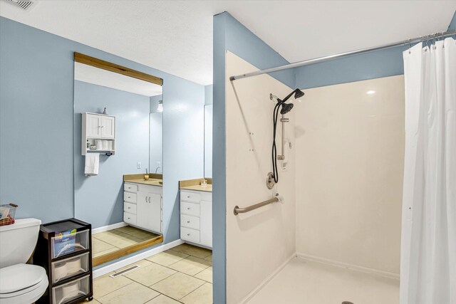 113 Holly Ridge Rd, Willard, MO 65781 - full bath featuring vanity, a shower with curtain, toilet, and tile patterned floors