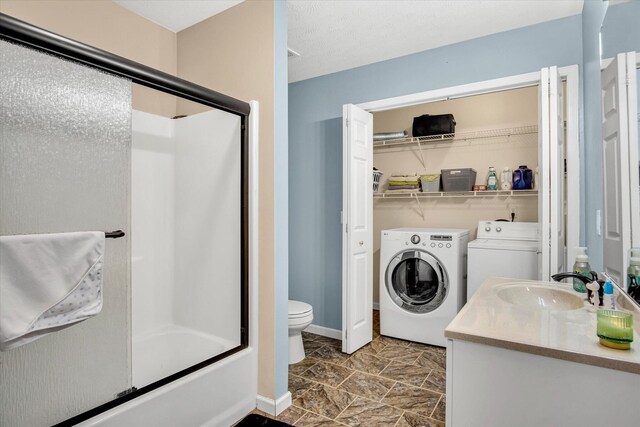 113 Holly Ridge Rd, Willard, MO 65781 - full bath featuring separate washer and dryer, toilet, vanity, and combined bath / shower with glass door
