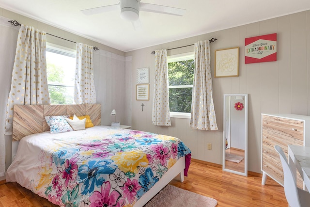 225 Elim St, Forsyth, MO 65653 - bedroom with wood finished floors, ceiling fan, and baseboards