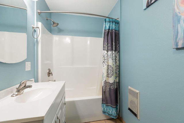 225 Elim St, Forsyth, MO 65653 - bathroom featuring vanity, shower / tub combo with curtain, heating unit, and tile patterned flooring
