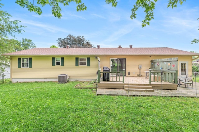 225 Elim St, Forsyth, MO 65653 - back of property featuring a yard, a deck, central AC unit, and a patio area