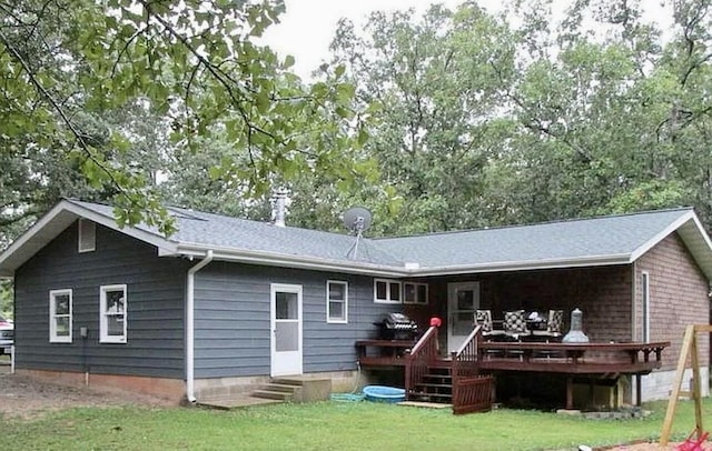 21371 Howell Rd, Mountain View, MO 65548 - rear view of house featuring a deck and a lawn