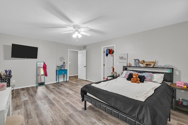 21371 Howell Rd, Mountain View, MO 65548 - bedroom with light wood-style flooring, ceiling fan, and baseboards