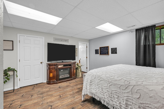 21371 Howell Rd, Mountain View, MO 65548 - bedroom with hardwood / wood-style flooring and a paneled ceiling