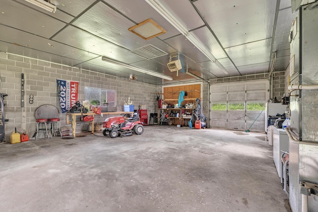 21371 Howell Rd, Mountain View, MO 65548 - garage featuring concrete block wall