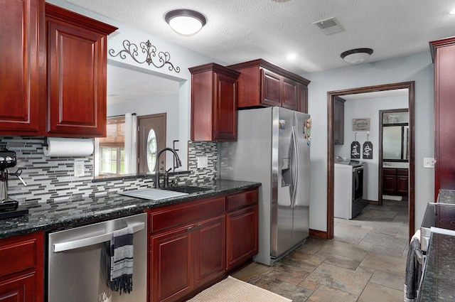 2526 State Highway B, Rogersville, MO 65742 - kitchen with washing machine and dryer and reddish brown cabinets
