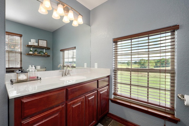 2526 State Highway B, Rogersville, MO 65742 - bathroom with vanity, plenty of natural light, a textured wall, and baseboards