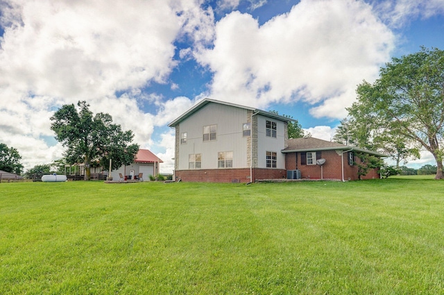 2526 State Highway B, Rogersville, MO 65742 - back of house featuring cooling unit, a yard, and brick siding