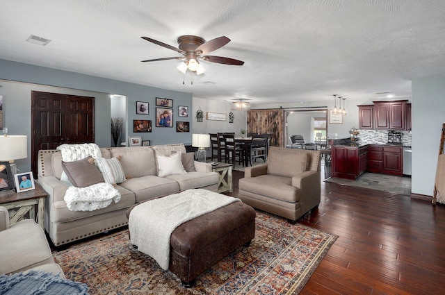 2526 State Highway B, Rogersville, MO 65742 - living area with a ceiling fan, dark wood-style floors, and a barn door