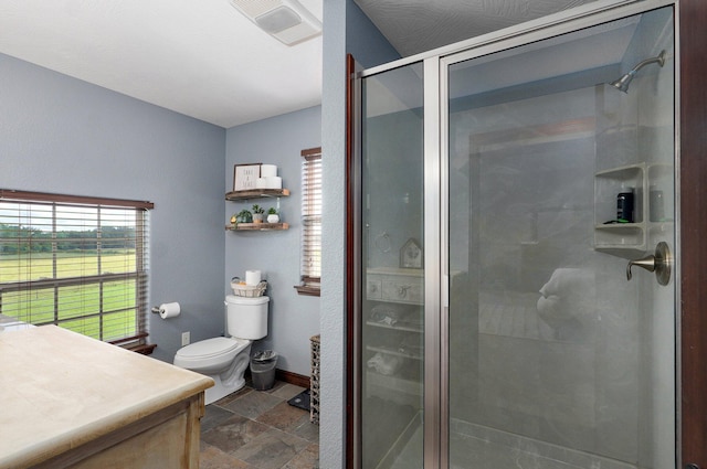 2526 State Highway B, Rogersville, MO 65742 - bathroom with stone finish flooring, a shower stall, vanity, toilet, and baseboards