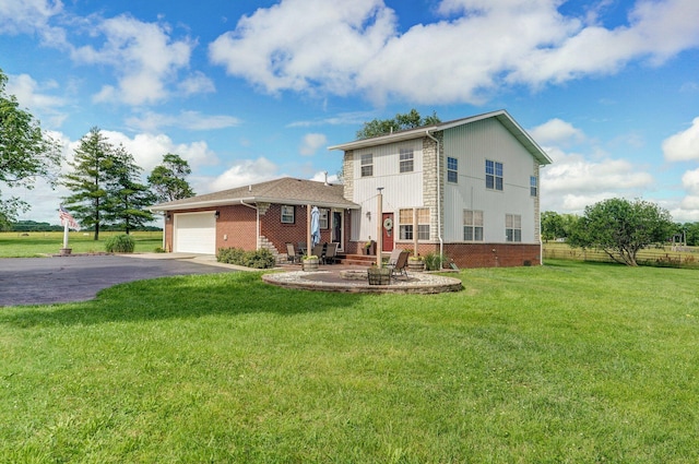 2526 State Highway B, Rogersville, MO 65742 - view of front of house featuring a garage, brick siding, driveway, and a front yard