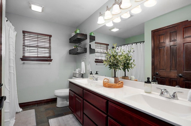 2526 State Highway B, Rogersville, MO 65742 - bathroom featuring toilet, double vanity, baseboards, stone tile flooring, and a shower with shower curtain