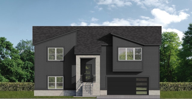 2509 W Pigeon Dr, Ozark, MO 65721 - view of front facade featuring an attached garage, roof with shingles, and driveway