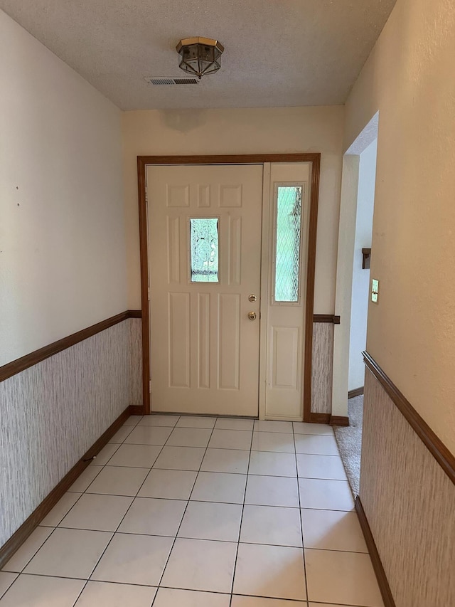 154A Scofield Ave, Forsyth, MO 65653 - entrance foyer featuring baseboards, a textured ceiling, and wallpapered walls