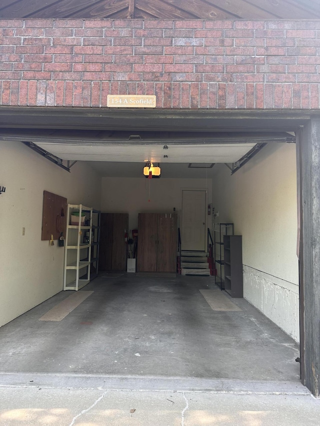 154A Scofield Ave, Forsyth, MO 65653 - garage featuring a garage door opener