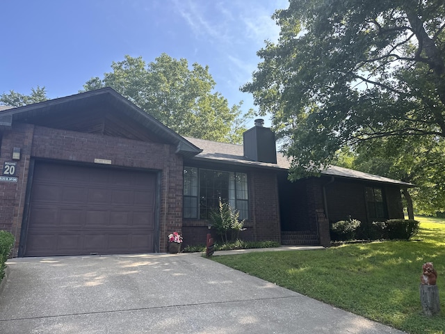 154A Scofield Ave, Forsyth, MO 65653 - ranch-style house featuring brick siding, an attached garage, driveway, and a chimney