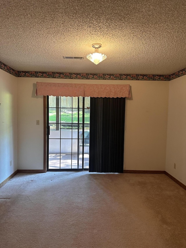 154A Scofield Ave, Forsyth, MO 65653 - empty room featuring carpet flooring, a textured ceiling, and baseboards