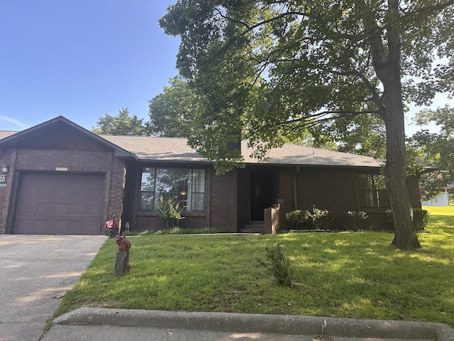 154A Scofield Ave, Forsyth, MO 65653 - ranch-style home with a garage, a front lawn, and brick siding