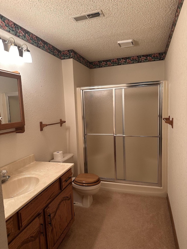 154A Scofield Ave, Forsyth, MO 65653 - full bath with a textured ceiling, vanity, a shower stall, toilet, and a textured wall