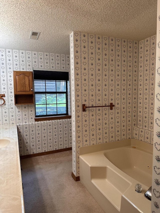 154A Scofield Ave, Forsyth, MO 65653 - full bath with a bath, a textured ceiling, wallpapered walls, baseboards, and a sink