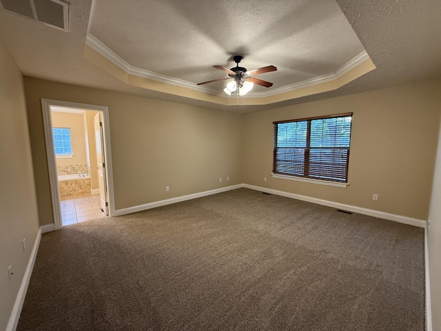 895 W Linwood Ave, Nixa, MO 65714 - unfurnished room featuring a raised ceiling, crown molding, a textured ceiling, dark carpet, and ceiling fan