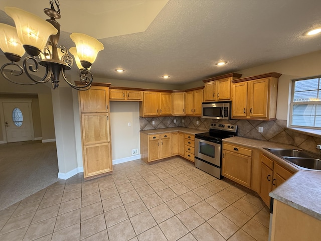 895 W Linwood Ave, Nixa, MO 65714 - kitchen featuring stainless steel appliances, a sink, a chandelier, tasteful backsplash, and recessed lighting