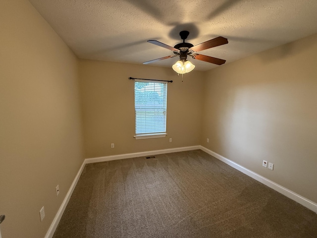895 W Linwood Ave, Nixa, MO 65714 - spare room featuring a ceiling fan, baseboards, dark carpet, and a textured ceiling