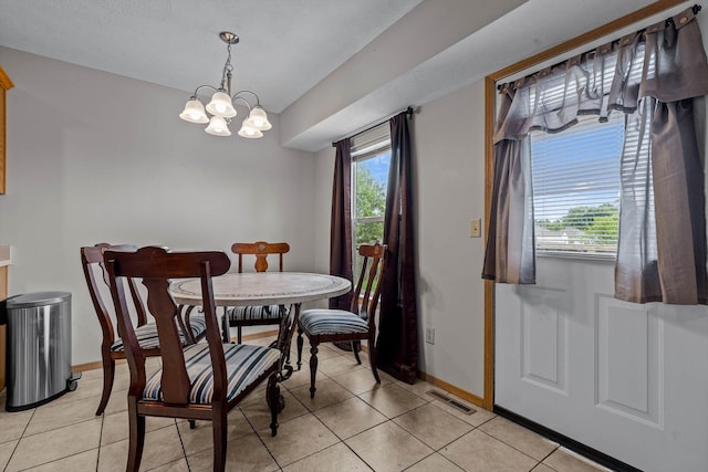 1382 S Kristopher Ave, Republic, MO 65738 - dining area featuring baseboards, a chandelier, and light tile patterned floors