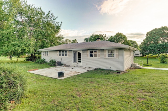 510 E College St, Walnut Grove, MO 65770 - back of property with a patio, a lawn, a chimney, and central air condition unit