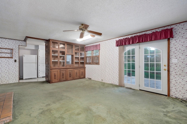 510 E College St, Walnut Grove, MO 65770 - unfurnished living room featuring wallpapered walls, a textured ceiling, ceiling fan, carpet flooring, and crown molding