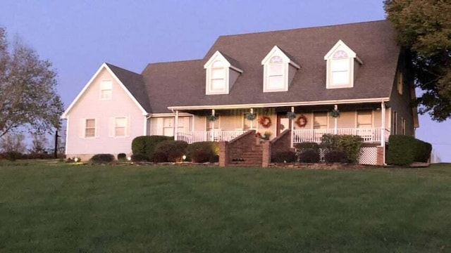 4402 Quail Run Rd, Ozark, MO 65721 - cape cod home featuring covered porch and a front lawn