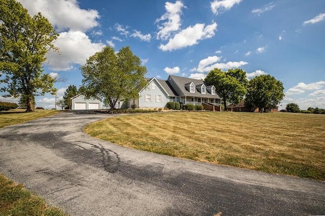 4402 Quail Run Rd, Ozark, MO 65721 - cape cod house with a front lawn and a detached garage