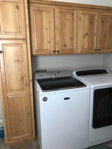 4402 Quail Run Rd, Ozark, MO 65721 - laundry area with independent washer and dryer and cabinet space