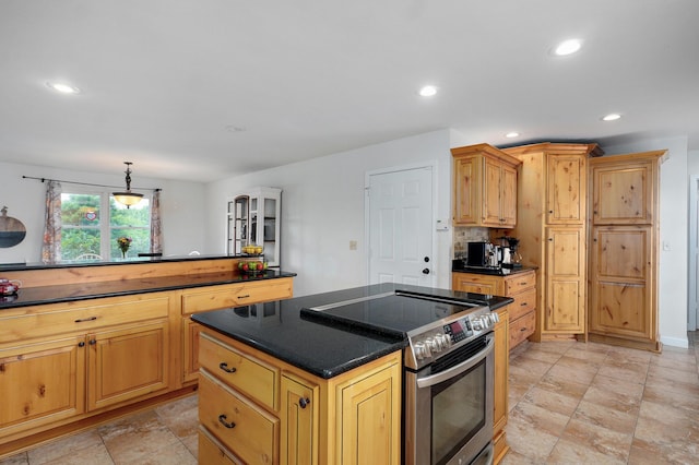 4402 Quail Run Rd, Ozark, MO 65721 - kitchen featuring electric stove, dark countertops, a kitchen island, recessed lighting, and light stone finish floors