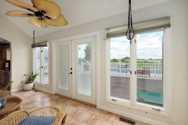 4402 Quail Run Rd, Ozark, MO 65721 - sunroom featuring arched walkways, baseboards, and vaulted ceiling