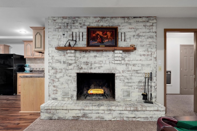 4402 Quail Run Rd, Ozark, MO 65721 - living room featuring a brick fireplace and wood finished floors