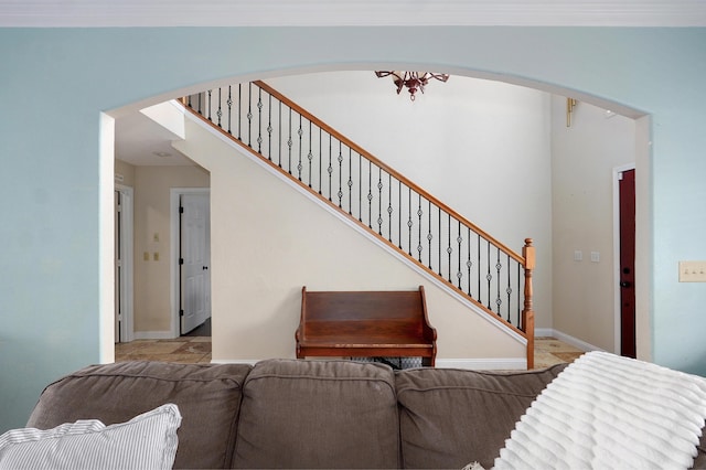 4402 Quail Run Rd, Ozark, MO 65721 - living room featuring arched walkways, stairs, and tile patterned floors