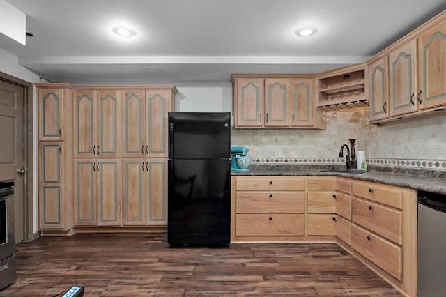4402 Quail Run Rd, Ozark, MO 65721 - kitchen with freestanding refrigerator, a sink, stainless steel dishwasher, dark countertops, and decorative backsplash
